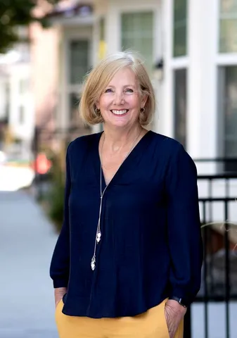 Woman in blue blouse outside