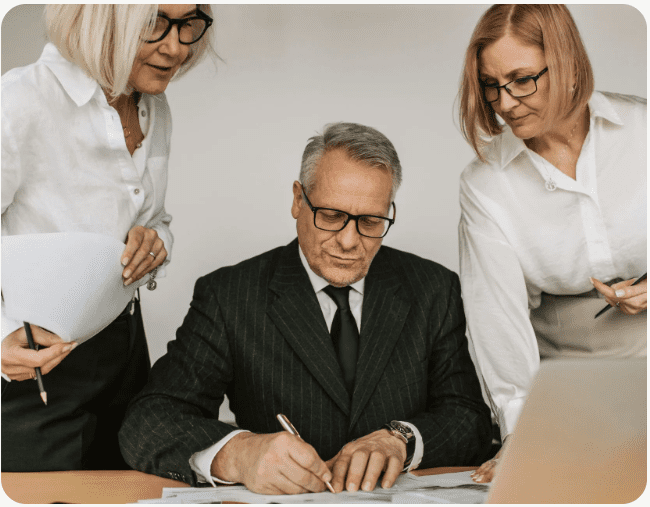 Executives collaborating on important documents.