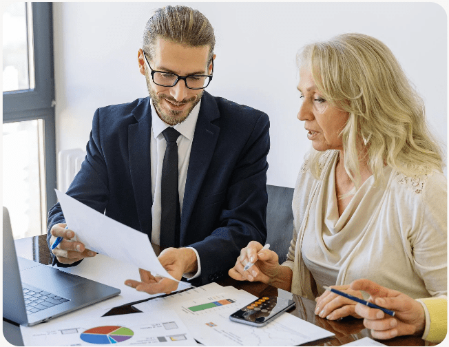 Two colleagues reviewing financial reports
