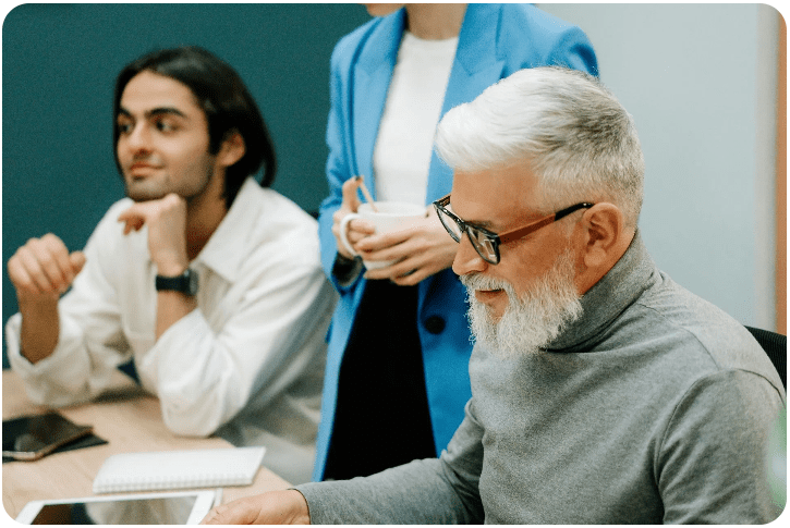 Colleagues discussing ideas at a table
