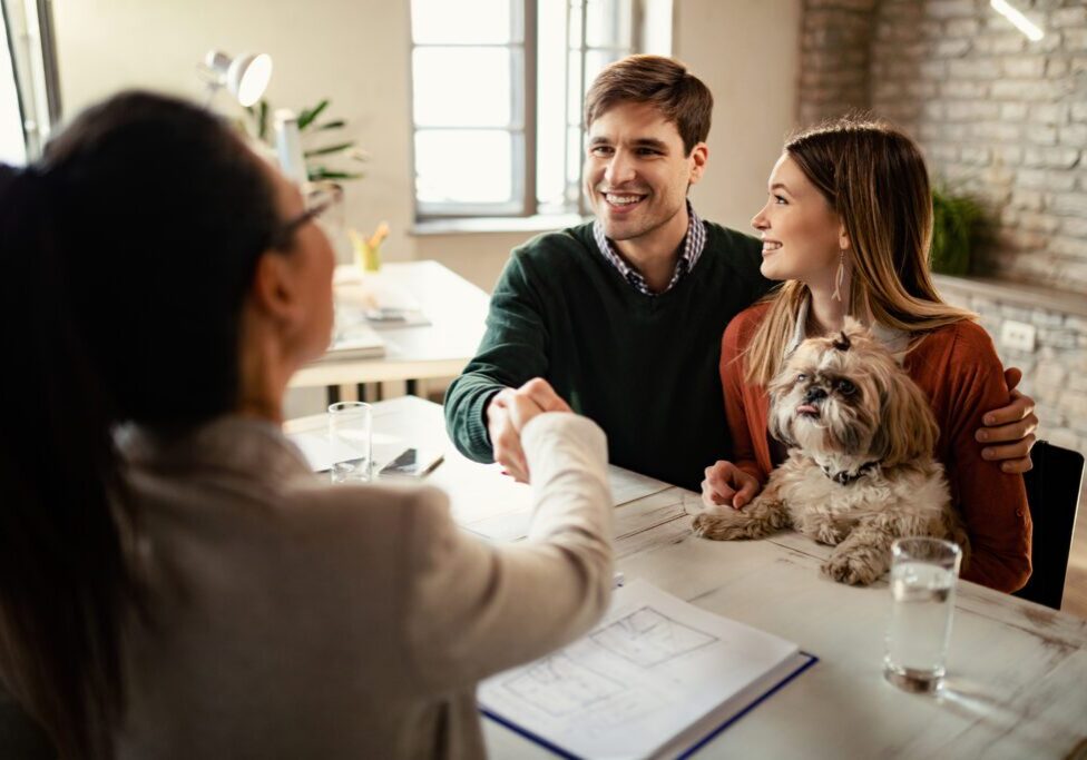 Couple meeting with advisor and dog